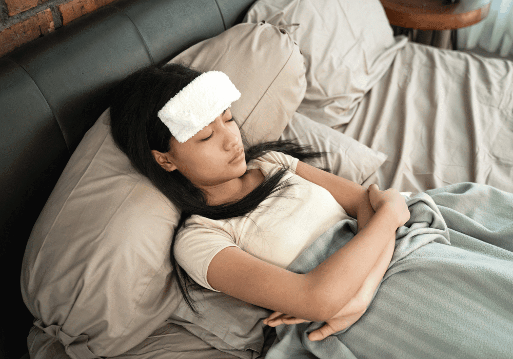 Young Woman laying on the bed with a chronic Illness thinking about recovery.