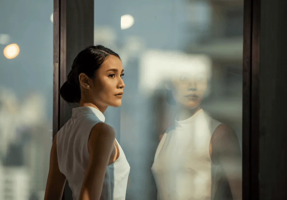 An adult reflecting on their childhood experiences representing honoring the inner young voice during personal growth