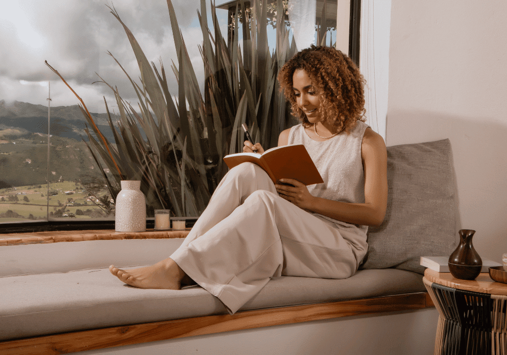 Person journaling peacefully representing clarity and self-reflection in setting boundaries